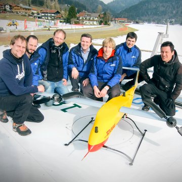 RWTH Aachen University team members with the Paketkopter on the DHL Skyport in Reit im Winkl RWTH Aachen University team members with the Paketkopter on the DHL Skyport in Reit im Winkl